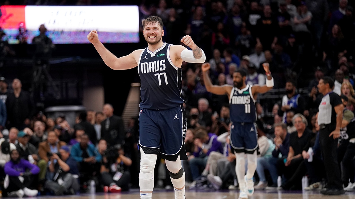 Dallas Mavericks guard Luka Doncic (77) celebrates after the Mavericks made a three point basket against the Sacramento Kings late in the fourth quarter at the Golden 1 Center.