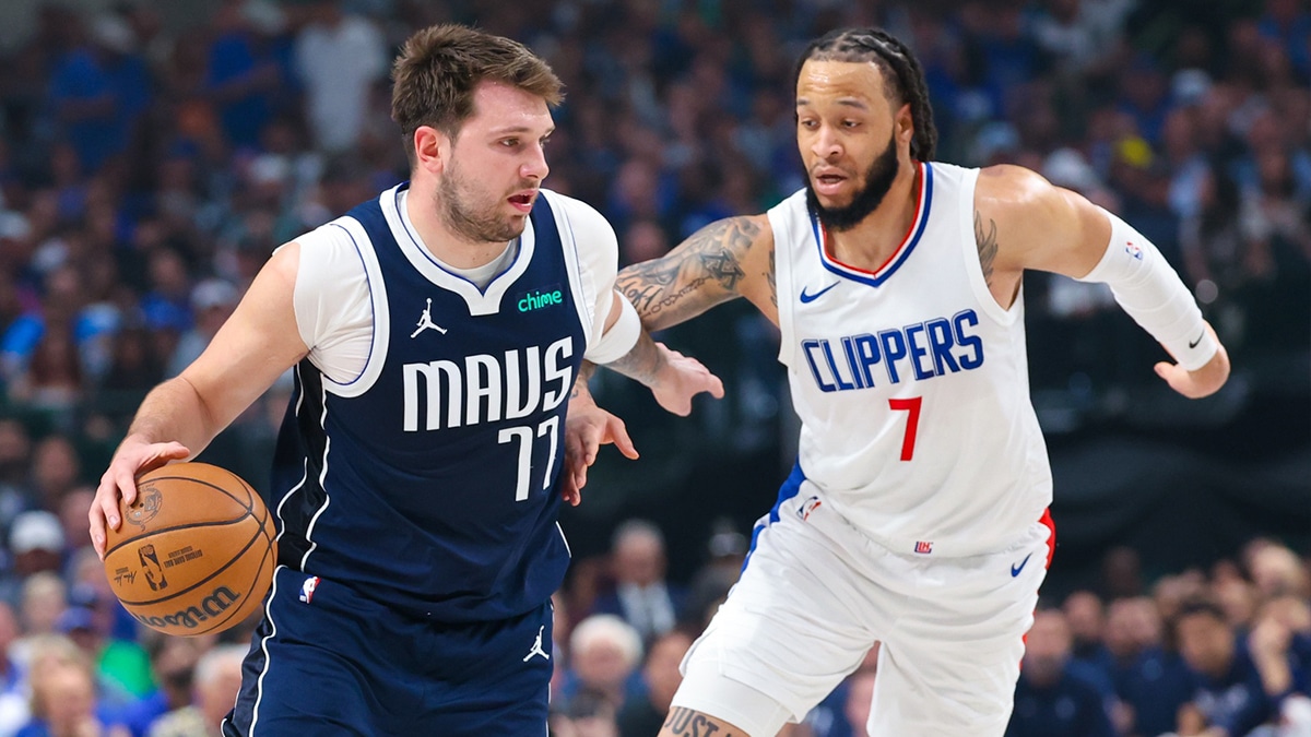 Dallas Mavericks guard Luka Doncic (77) controls the ball as LA Clippers guard Amir Coffey (7) defends during the first quarter during game four of the first round for the 2024 NBA playoffs at American Airlines Center