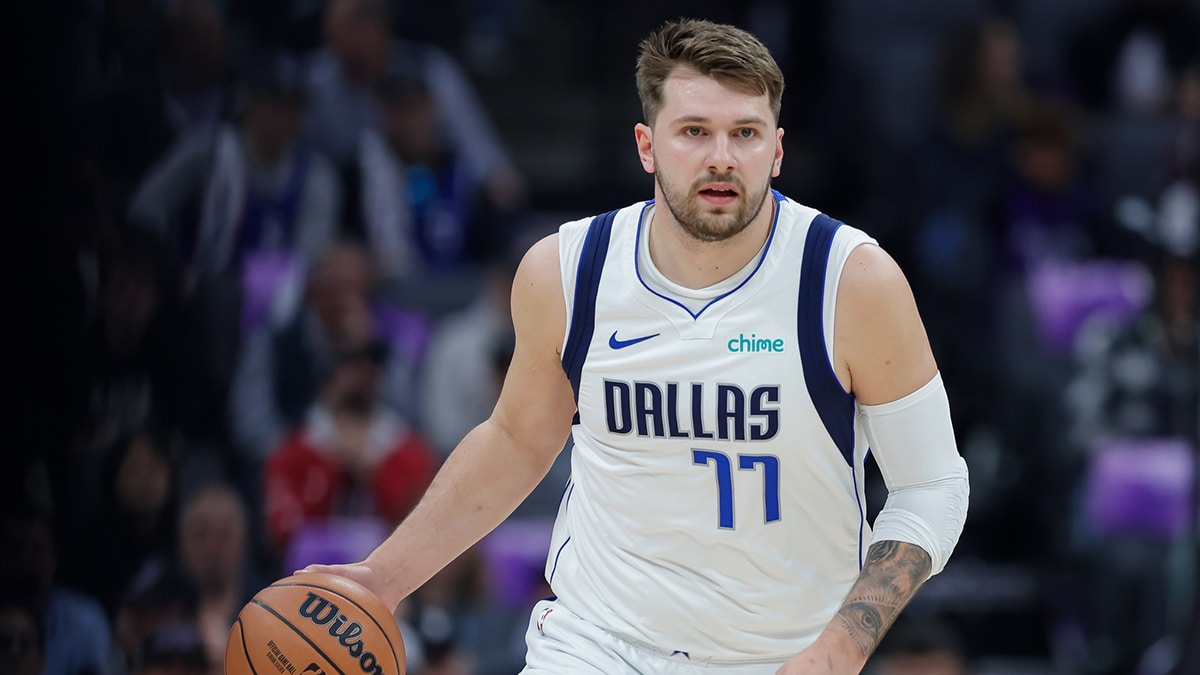 Dallas Mavericks guard Luka Doncic (77) dribbles the ball up to the court against the Sacramento Kings during the first quarter at Golden 1 Center. 