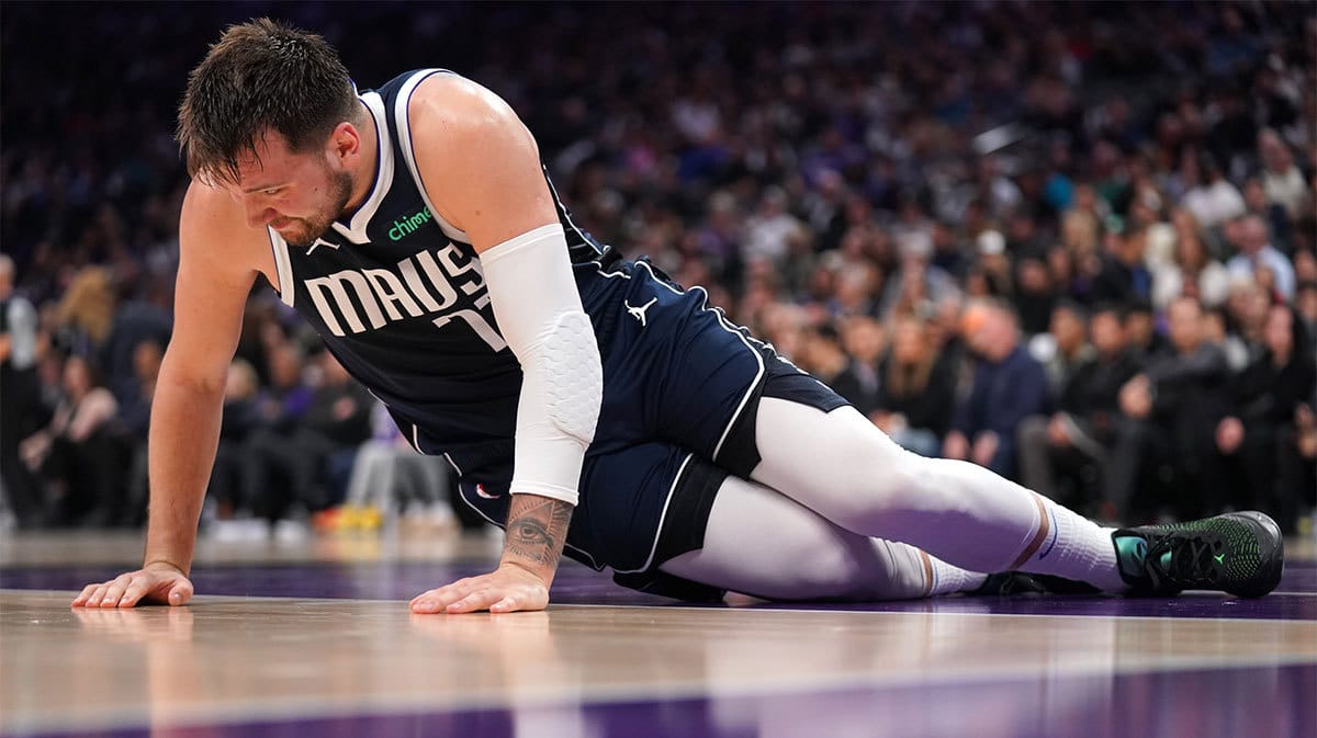 Dallas Mavericks guard Luka Doncic (77) regains his footing after falling to the ground against the Sacramento Kings in the second quarter at the Golden 1 Center.