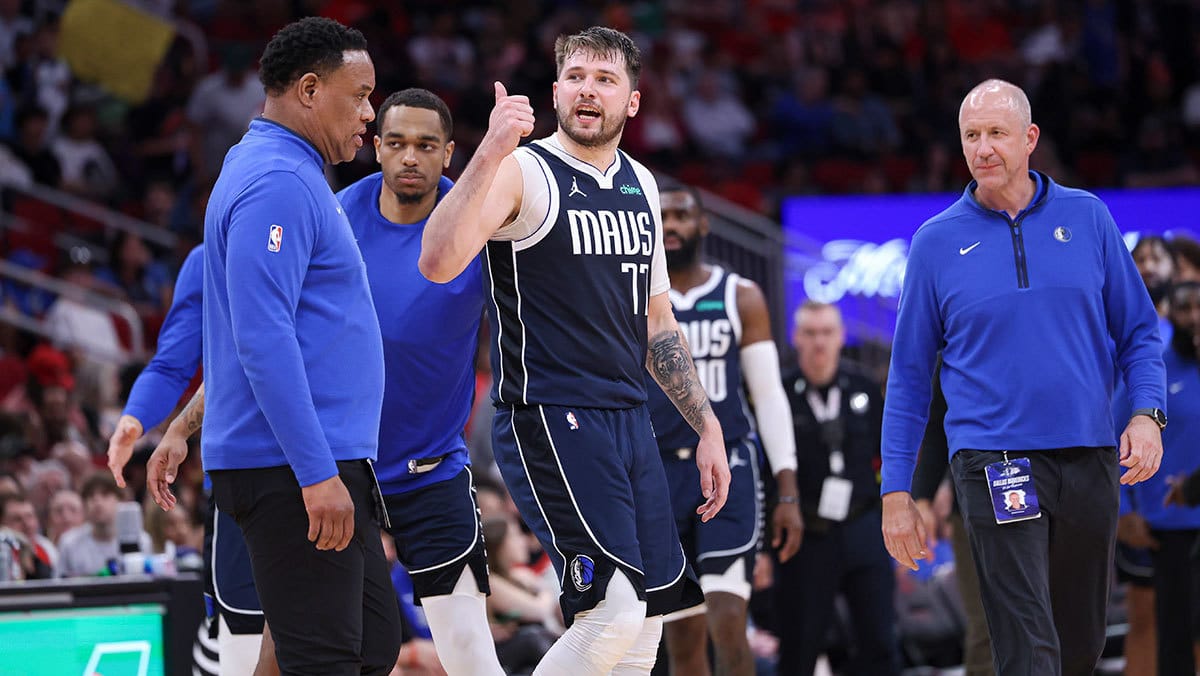 Dallas Mavericks guard Luka Doncic (77) has words with the Houston Rockets bench during the fourth quarter at Toyota Center.