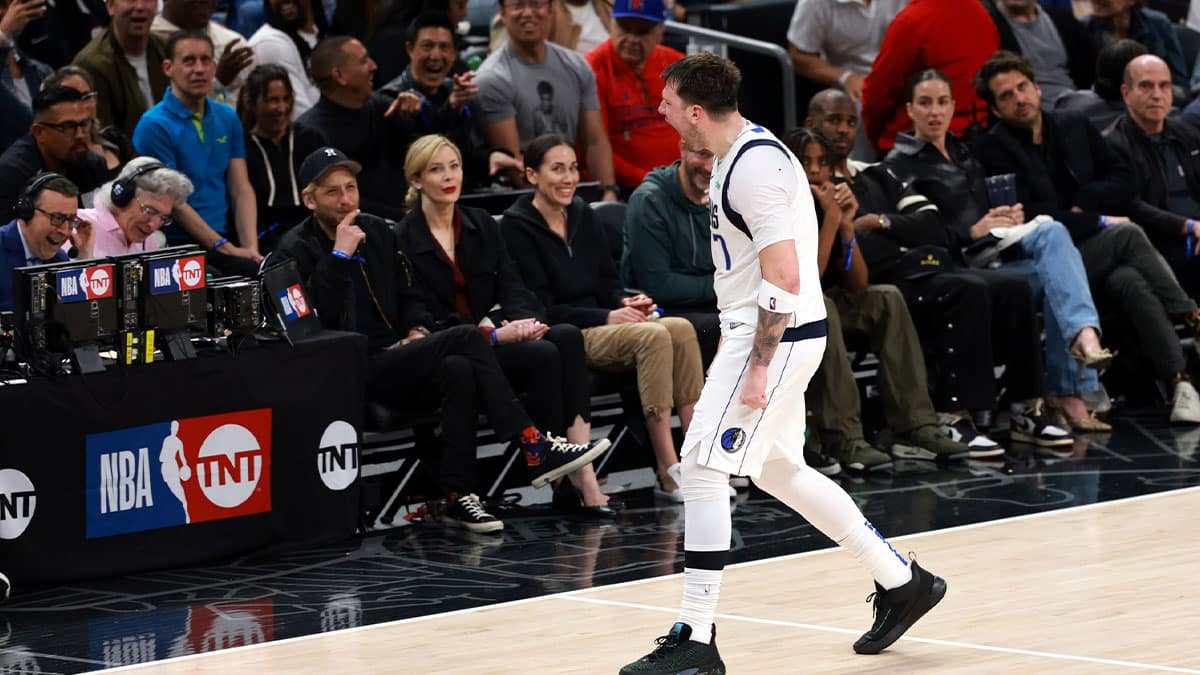 Dallas Mavericks guard Luka Doncic (77) reacts after making a three-point basket during the fourth quarter of game two of the first round for the 2024 NBA playoffs against the Los Angeles Clippers at Crypto.com Arena