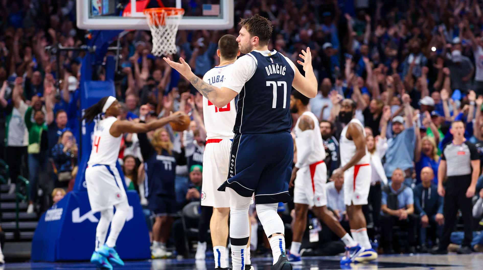Dallas Mavericks guard Luka Doncic (77) reacts after scoring during the second half against the LA Clippers during game four of the first round for the 2024 NBA playoffs at American Airlines Center.