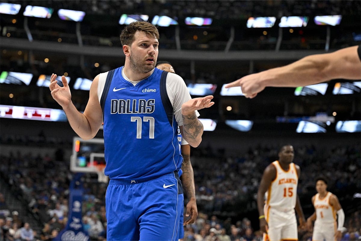 Dallas Mavericks guard Luka Doncic (77) reacts to a foul call during the first quarter against the Atlanta Hawks at the American Airlines Center. 