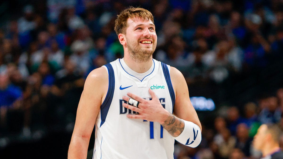 Dallas Mavericks guard Luka Doncic (77) smiles during the fourth quarter against the Houston Rockets at American Airlines Center.
