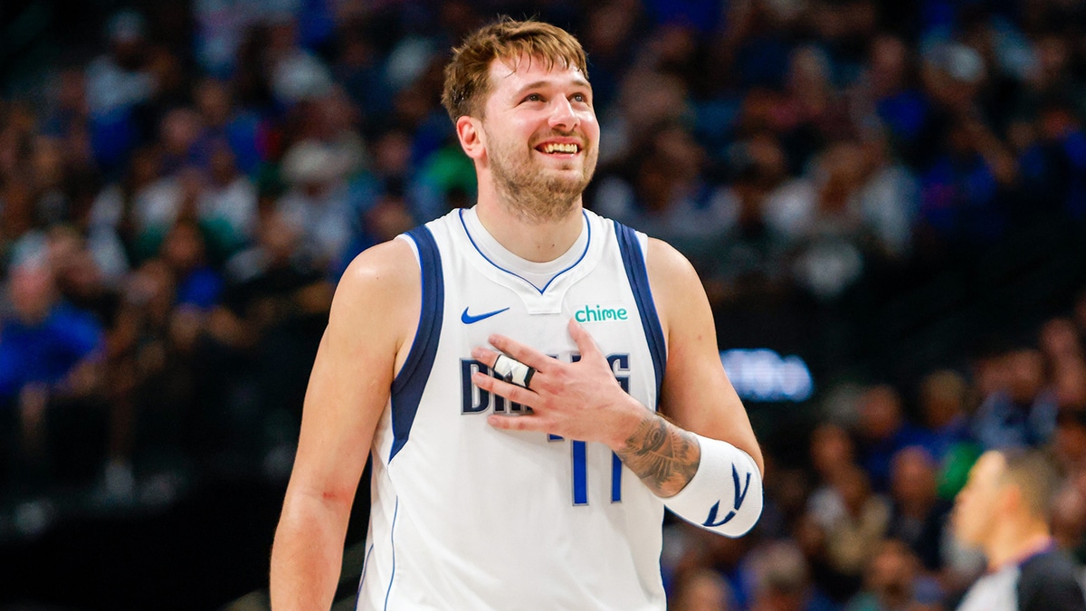 Dallas Mavericks guard Luka Doncic (77) smiles during the fourth quarter against the Houston Rockets at American Airlines Center. 