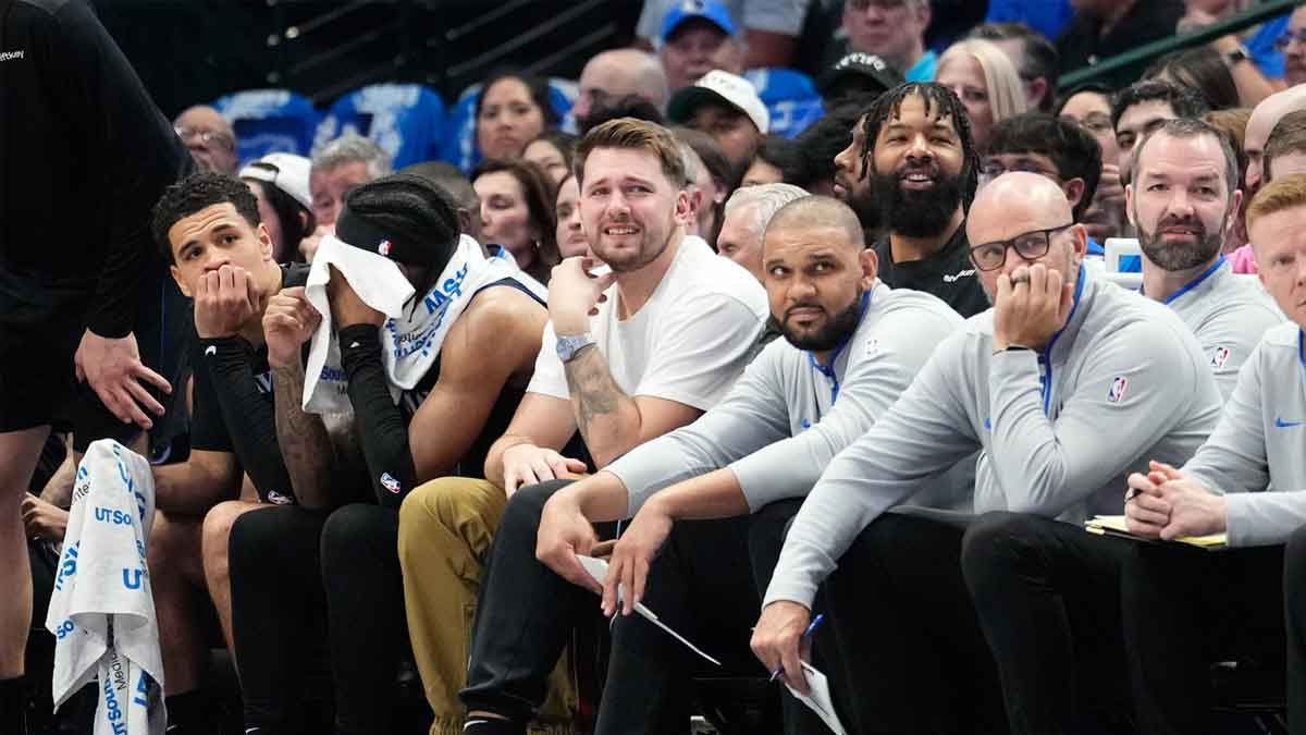Luka Doncic looks on from the bench during the game against the Detroit Pistons at American Airlines Center.