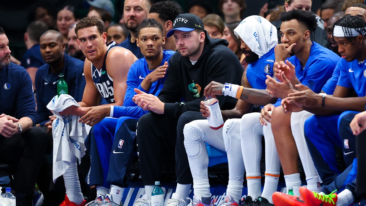 Dallas Mavericks guard Luka Doncic looks on from the bench during the game against the Golden State Warriors at American Airlines Center.