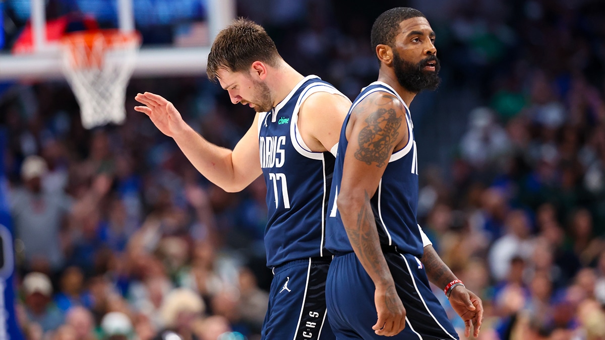 Dallas Mavericks guard Kyrie Irving (11) celebrates with Dallas Mavericks guard Luka Doncic (77) during the second half against the Denver Nuggets at American Airlines Center.