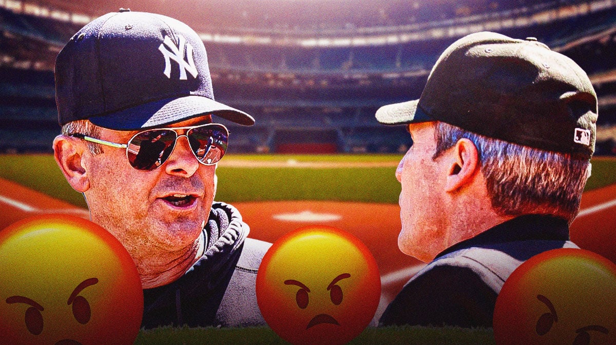 Aaron Boone looking angry with angry emojis by him. Angel Hernandez