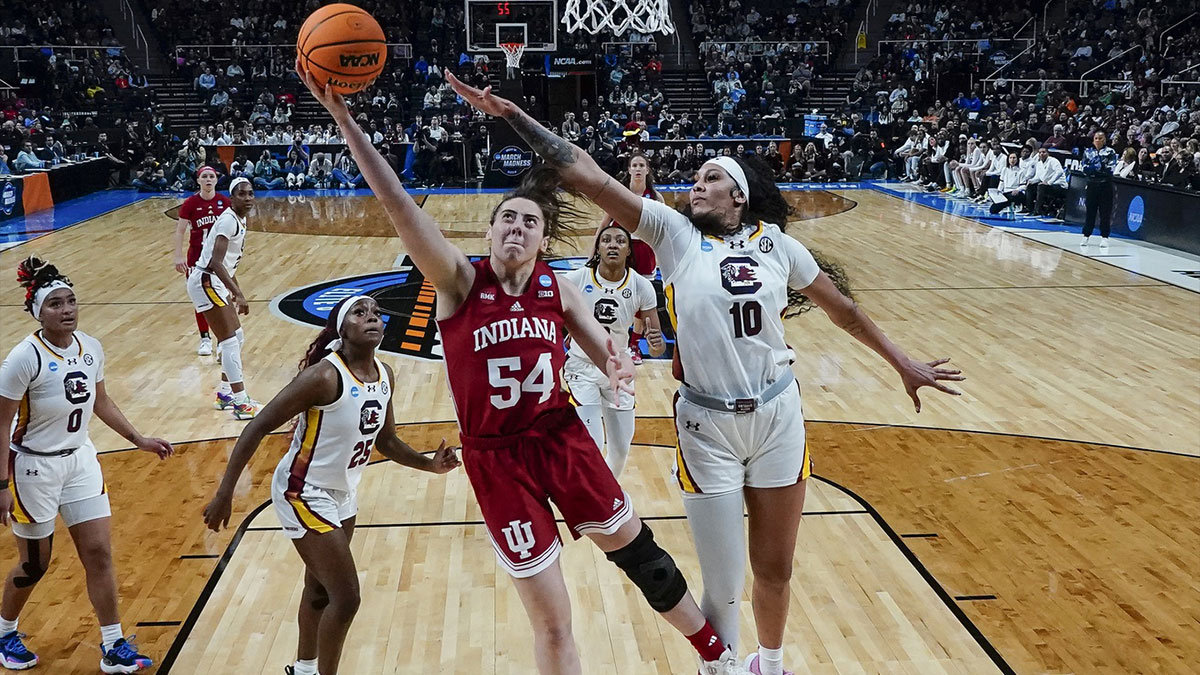 Indiana Hoosiers forward Mackenzie Holmes (54) shoots a layup against South Carolina Gamecocks center Kamilla Cardoso (10) during the second half in the semifinals of the Albany Regional of the 2024 NCAA Tournament at the MVP Arena.