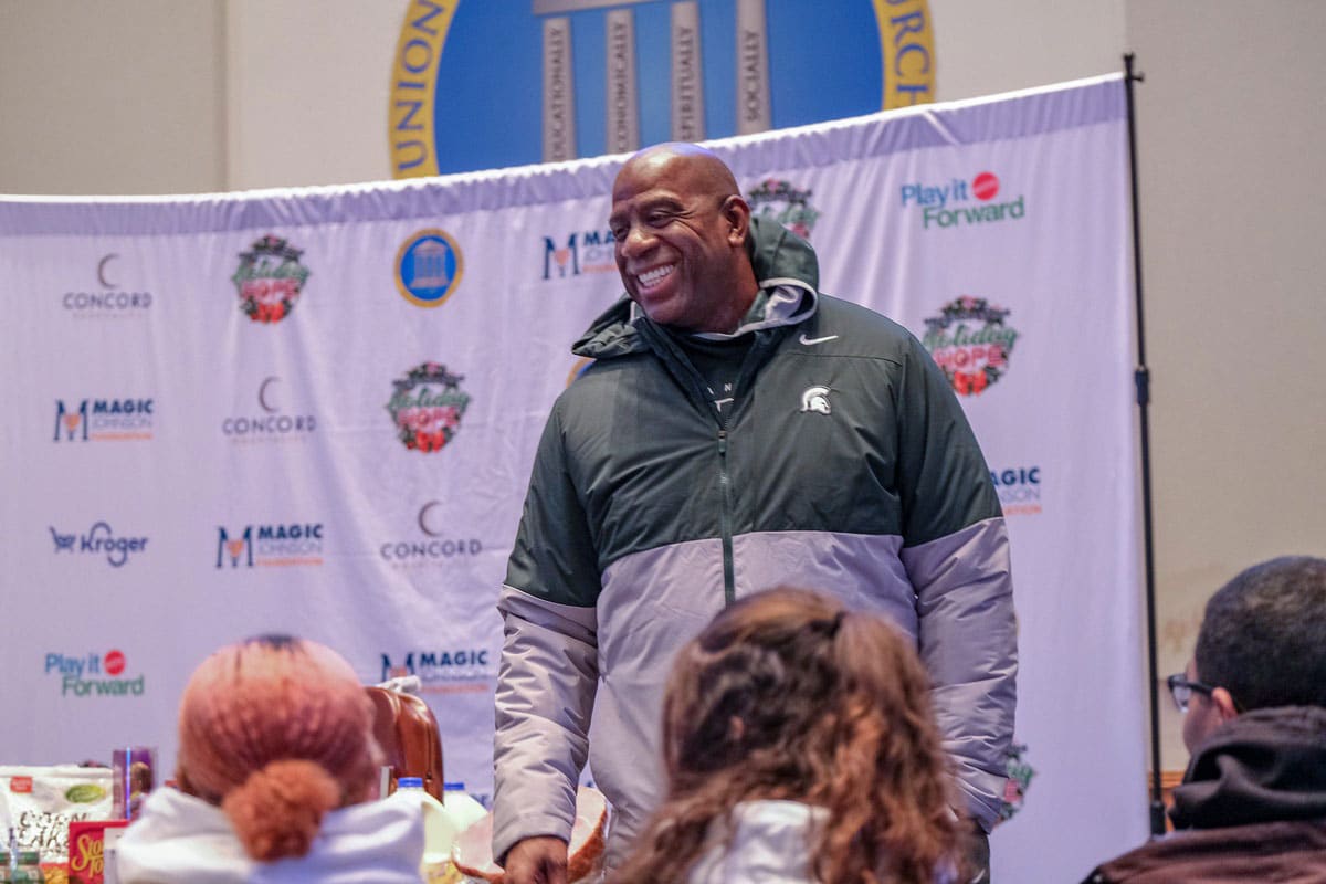 Earvin \"Magic\" Johnson speaks to a group of volunteers before his Holiday Hope for Families event gets underway Saturday, Nov. 11, 2023, at the Union Missionary Baptist Church in Lansing.