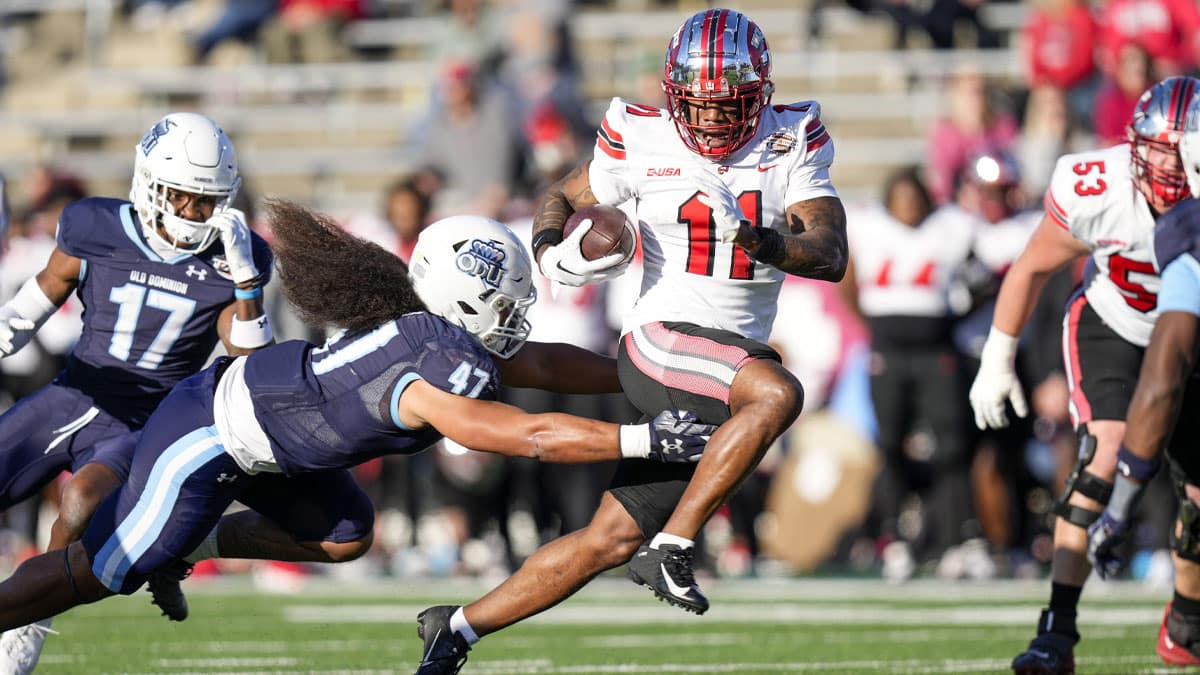 Western Kentucky Hilltoppers wide receiver Malachi Corley (11) runs the ball against Old Dominion Monarchs linebacker Koa Naotala (47) during the first quarter at Charlotte 49ers' Jerry Richardson Stadium.