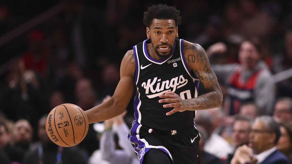 Sacramento Kings guard Malik Monk (0) dribbles top the court during the first half against the Washington Wizards at Capital One Arena. 
