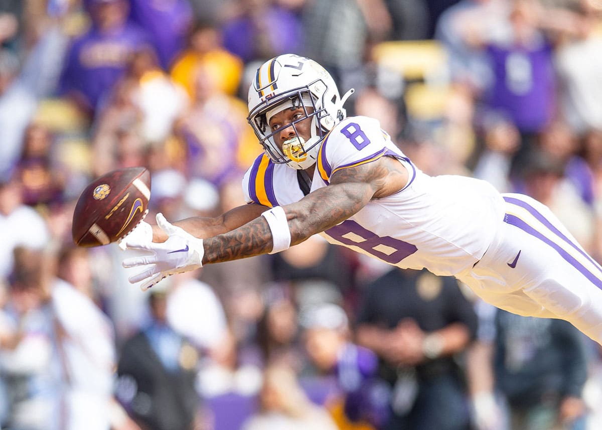 Malik Nabers 8 dives for a ball as the LSU Tigers take on Texas A&M in Tiger Stadium in Baton Rouge, Louisiana