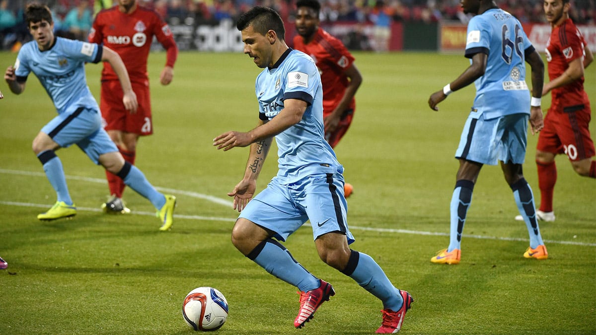 Manchester City forward Sergio Aguero (16) dribbles into the Toronto FC penalty area in the second half of an international club friendly at BMO Field. 