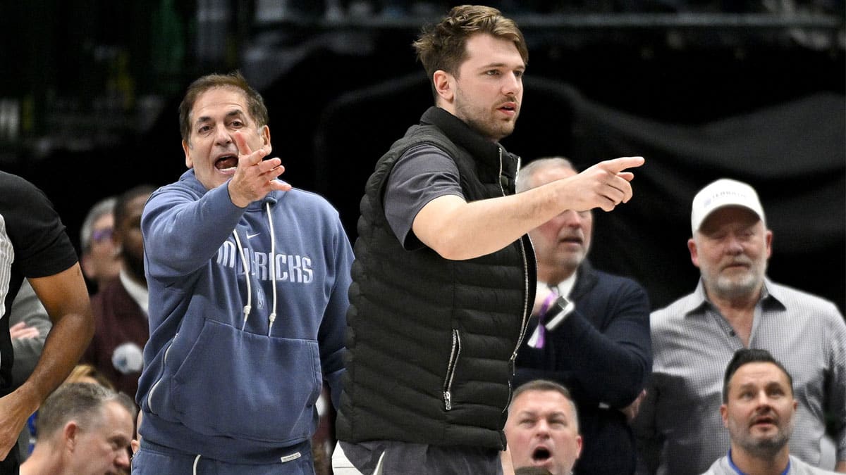 Dallas Mavericks guard Luka Doncic (right) and Mark Cuban (left) argue a call during the second half of the game against the New Orleans Pelicans at the American Airlines Center.