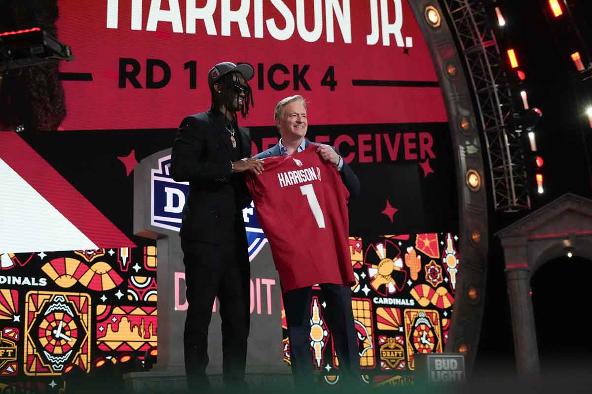 Ohio State Buckeyes wide receiver Marvin Harrison Jr. poses with NFL commissioner Roger Goodell after being selected by the Arizona Cardinals as the No. 4 pick in the first round of the 2024 NFL Draft at Campus Martius Park and Hart Plaza.