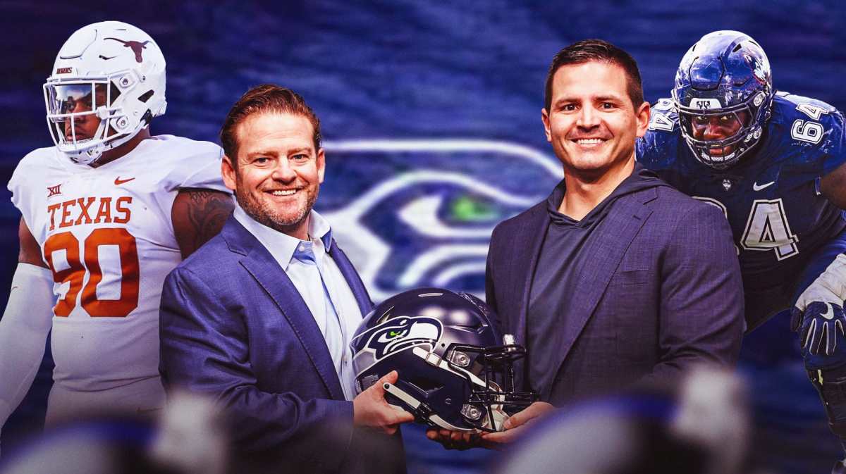 John Schneider in the middle, Byron Murphy II, Christian Haynes, Coach Mike Macdonald around him, Seattle Seahawks wallpaper in the background