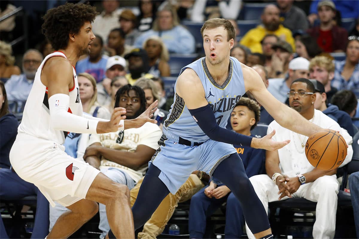 Memphis Grizzlies guard Luke Kennard (10) passes the ball as Portland Trail Blazers guard Matisse Thybulle (4) defends during the second half at FedExForum. 