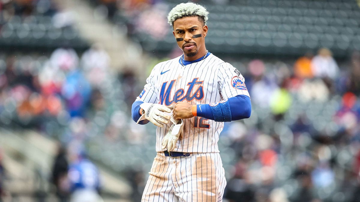 New York Mets shortstop Francisco Lindor (12) goes back to take the field after flying out with a runner on base to end the fifth inning against the Kansas City Royals at Citi Field.