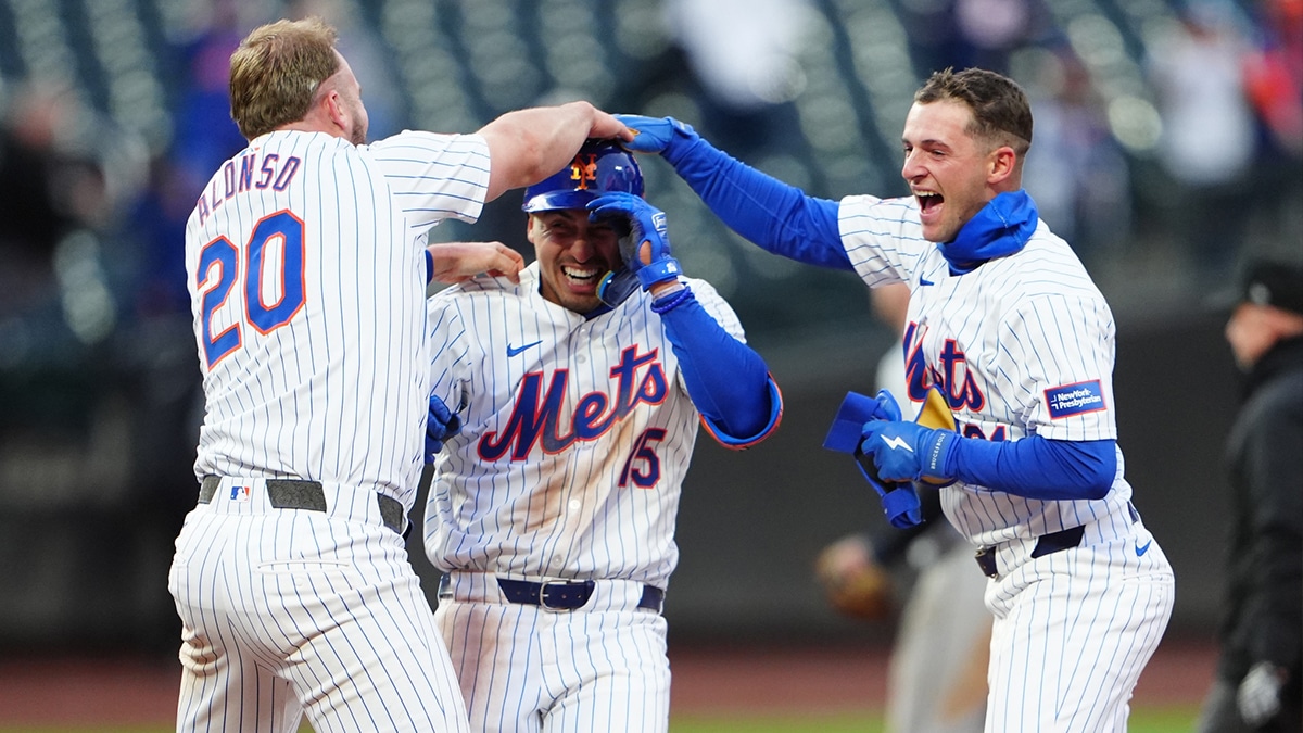 New York Mets first baseman Pete Alonso (20) and third baseman Zack Short (21) congratulate left fielder Tyrone Taylor (15) for the winning hit against the Detroit Tigers during the ninth inning at Citi Field