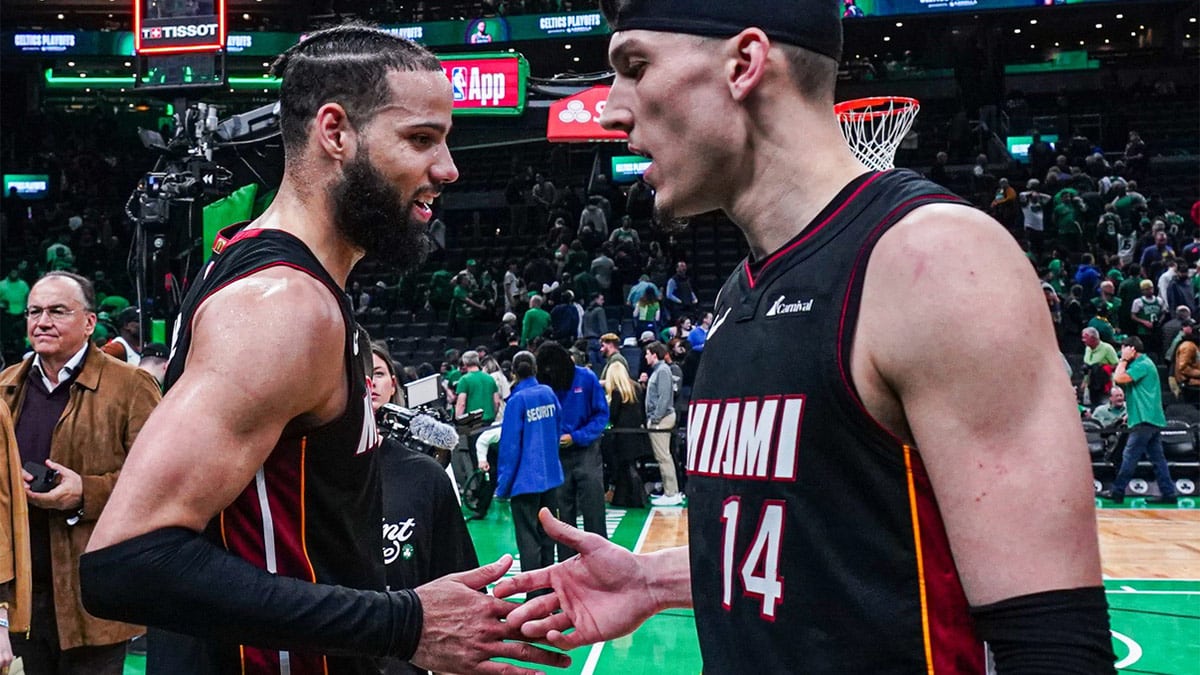 Miami Heat guard Tyler Herro (14) and forward Caleb Martin (16) react after defeating the Boston Celtics in game two of the first round for the 2024 NBA playoffs at TD Garden.