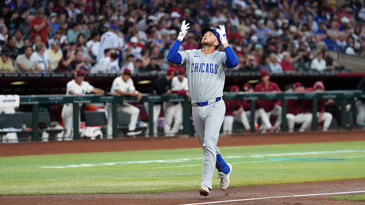 Chicago Cubs first baseman Michael Busch celebrates after hitting a solo home run against the Arizona Diamondbacks during the second inning at Chase Field. All players wore number 42 to commemorate Jackie Robinson Day.