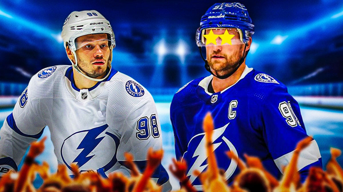 Mikhail Sergachev on one side, Steven Stamkos on the other side with stars in his eyes