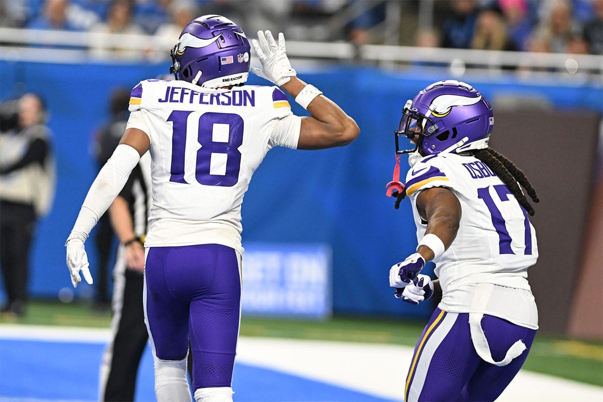 Minnesota Vikings wide receiver Justin Jefferson (18) celebrates with wide receiver K.J. Osborn (17) after scoring a touchdown against the Detroit Lions in the third quarter at Ford Field.