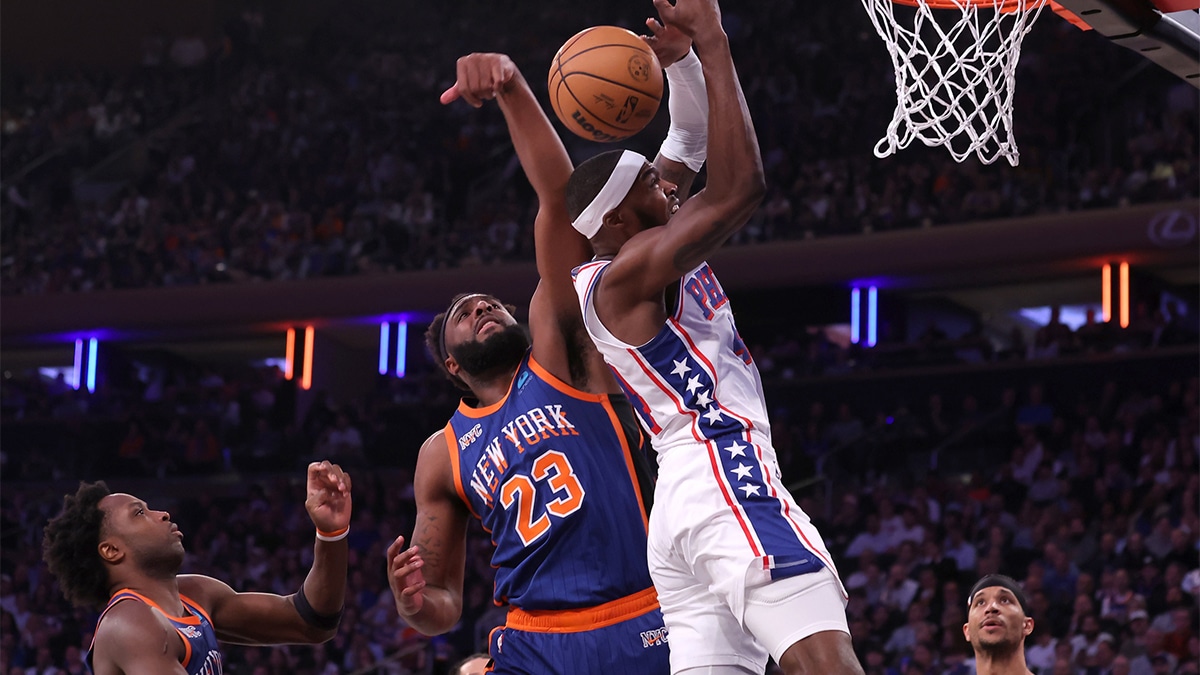 Knicks center Mitchell Robinson (23) blocks a shot by Philadelphia 76ers forward Paul Reed (44)