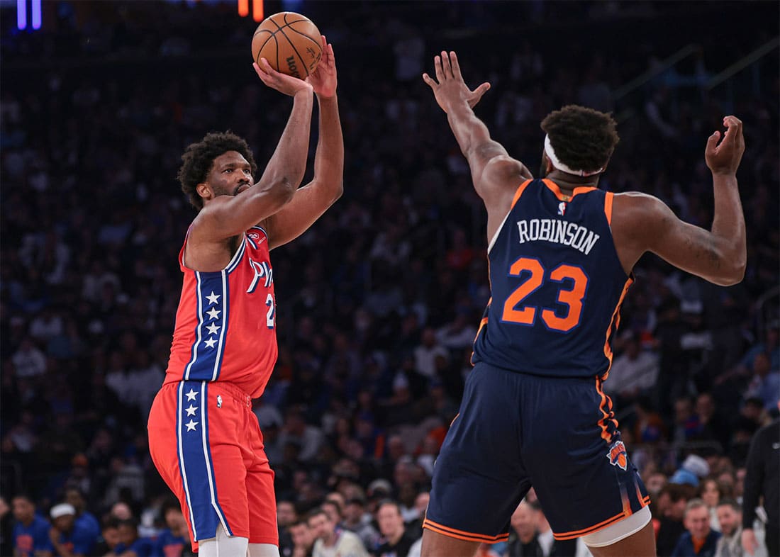 Philadelphia 76ers center Joel Embiid (21) shoots the ball as New York Knicks center Mitchell Robinson (23) defends during the first half during game two of the first round for the 2024 NBA playoffs at Madison Square Garden.