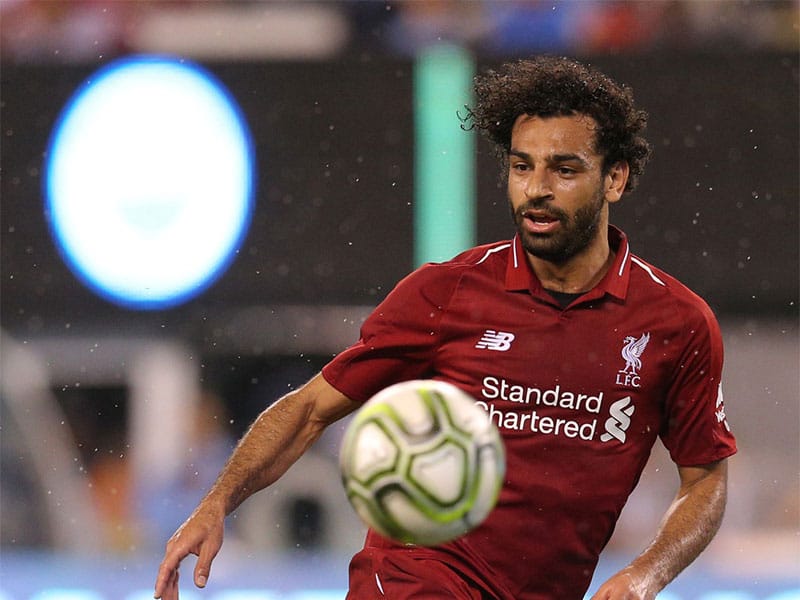 Liverpool forward Mohamed Salah (11) plays the ball against Manchester City during the second half of an International Champions Cup soccer match at MetLife Stadium