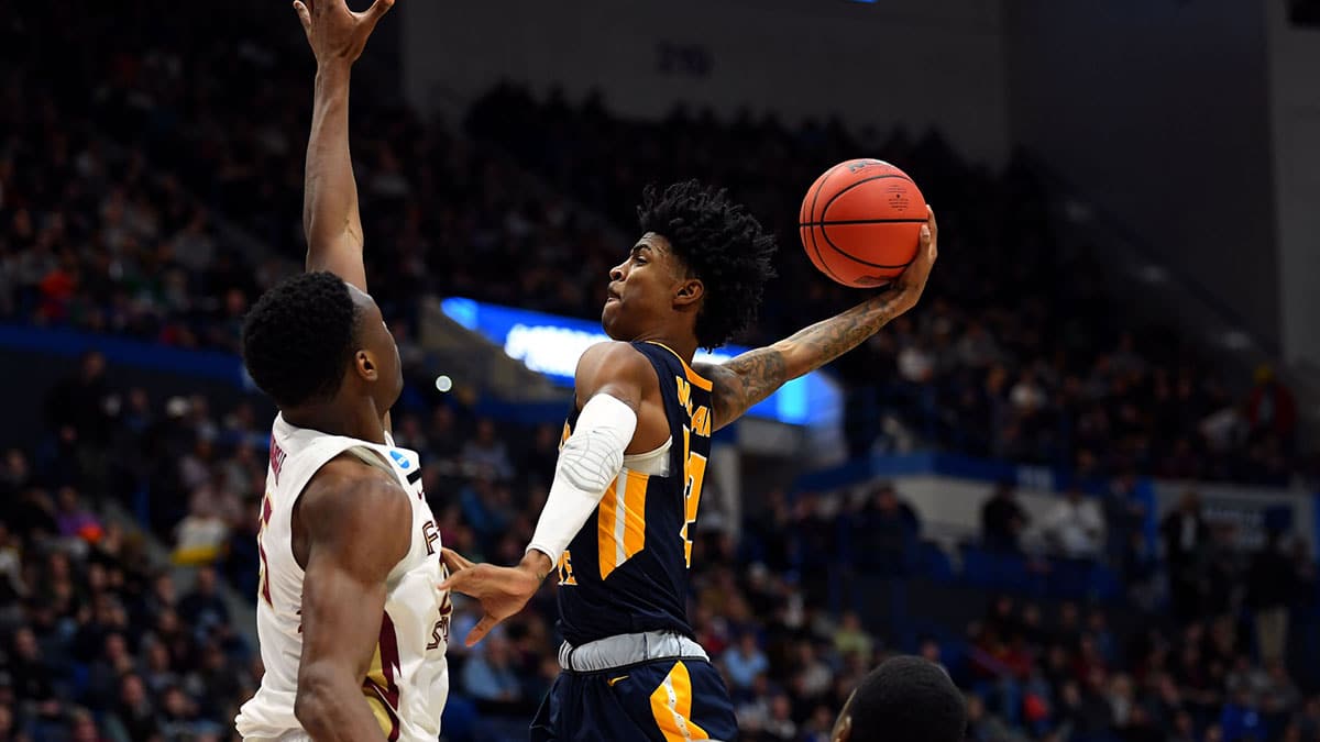 Murray State Racers guard Ja Morant (12) attempt a layup against Florida State Seminoles forward Mfiondu Kabengele (25) during the second half of game in the second round of the 2019 NCAA Tournament at XL Center. 