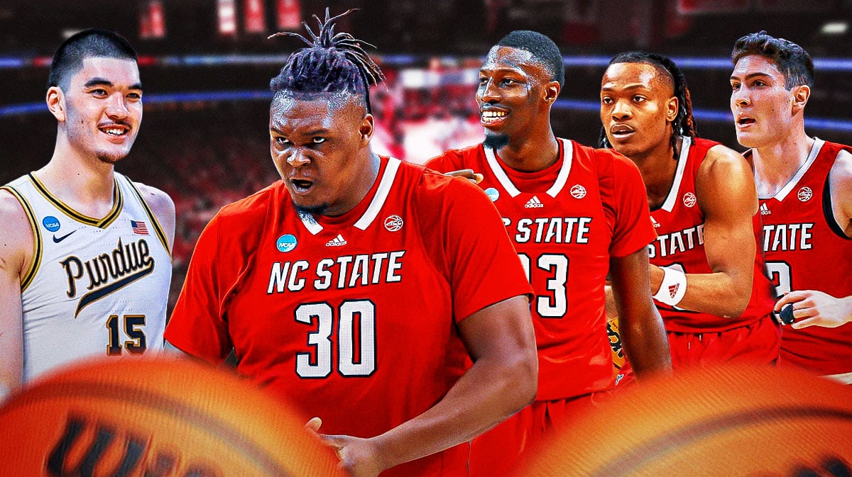 Purdue star Zach Edey with NC State basketball players DJ Burns Mohamed Diarra looking.