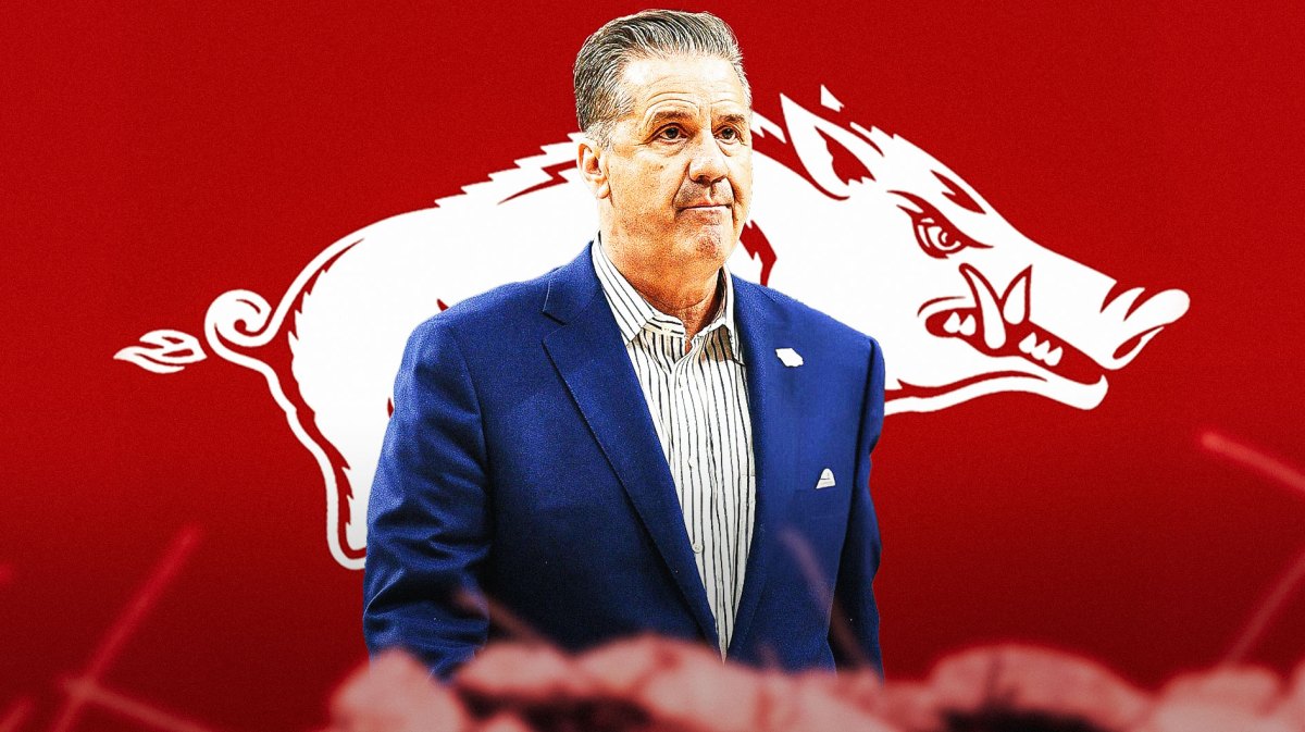 Kentucky basketball's John Calipari stands in front of Arkansas logo