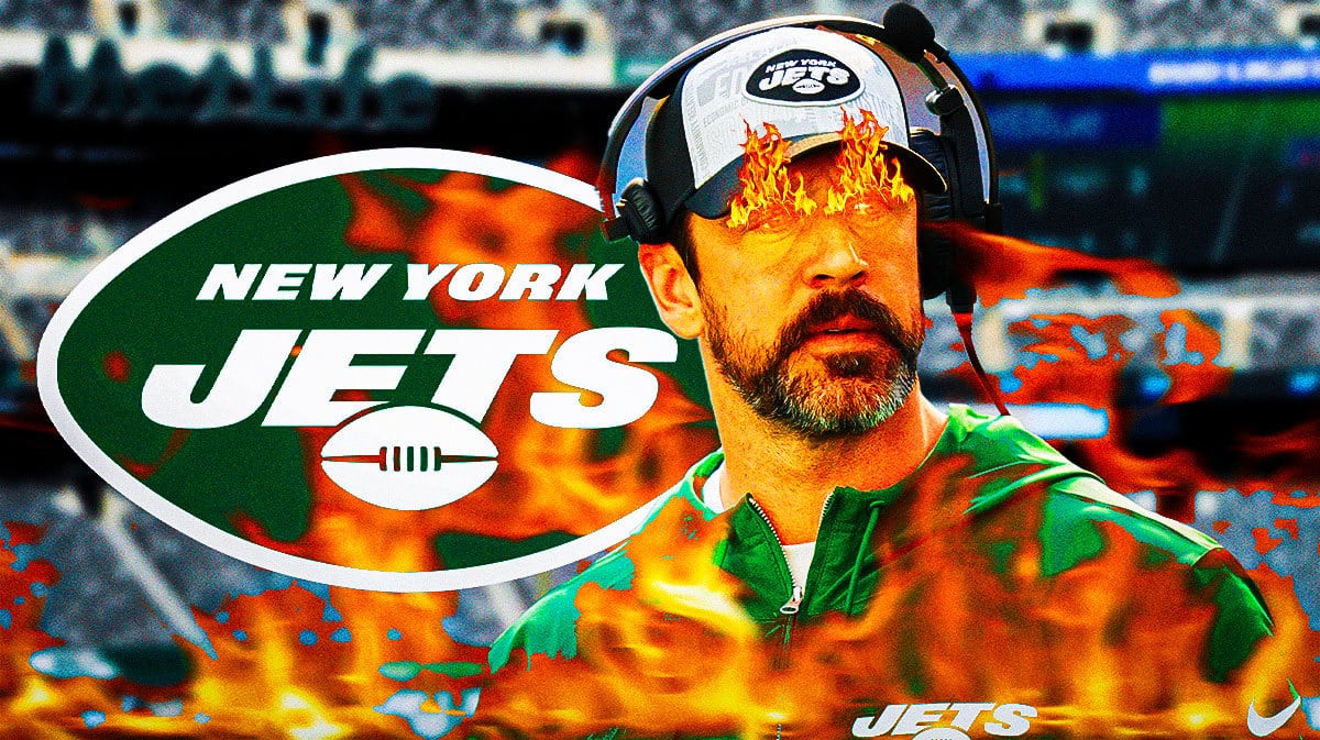 Jets Aaron Rodgers with fire in his eyes and surrounded by fire