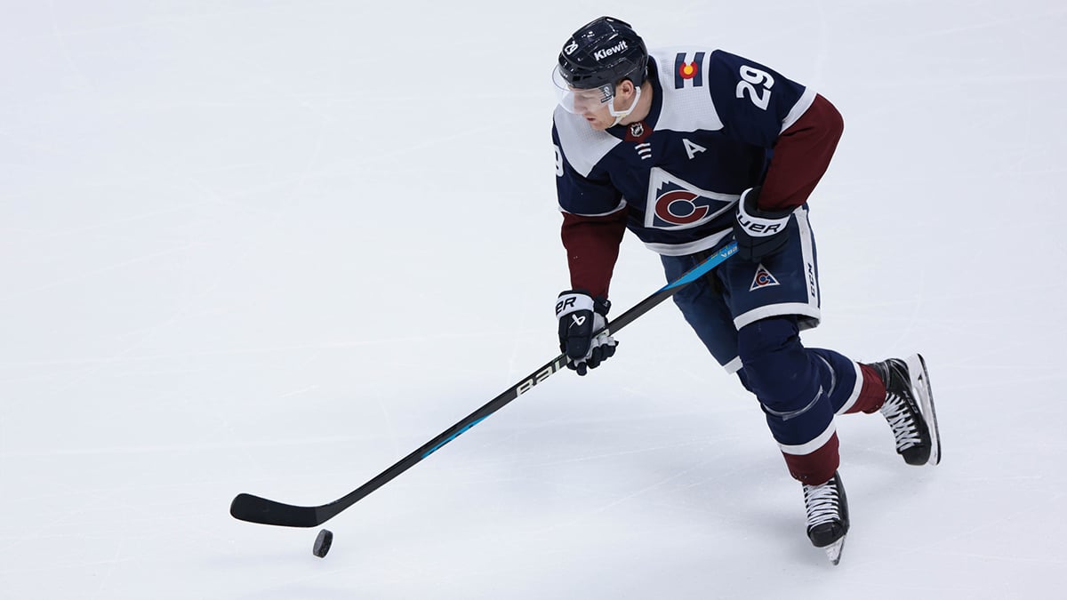 Colorado Avalanche center Nathan MacKinnon (29) skates with the puck during the third period against the Nashville Predators at Ball Arena.