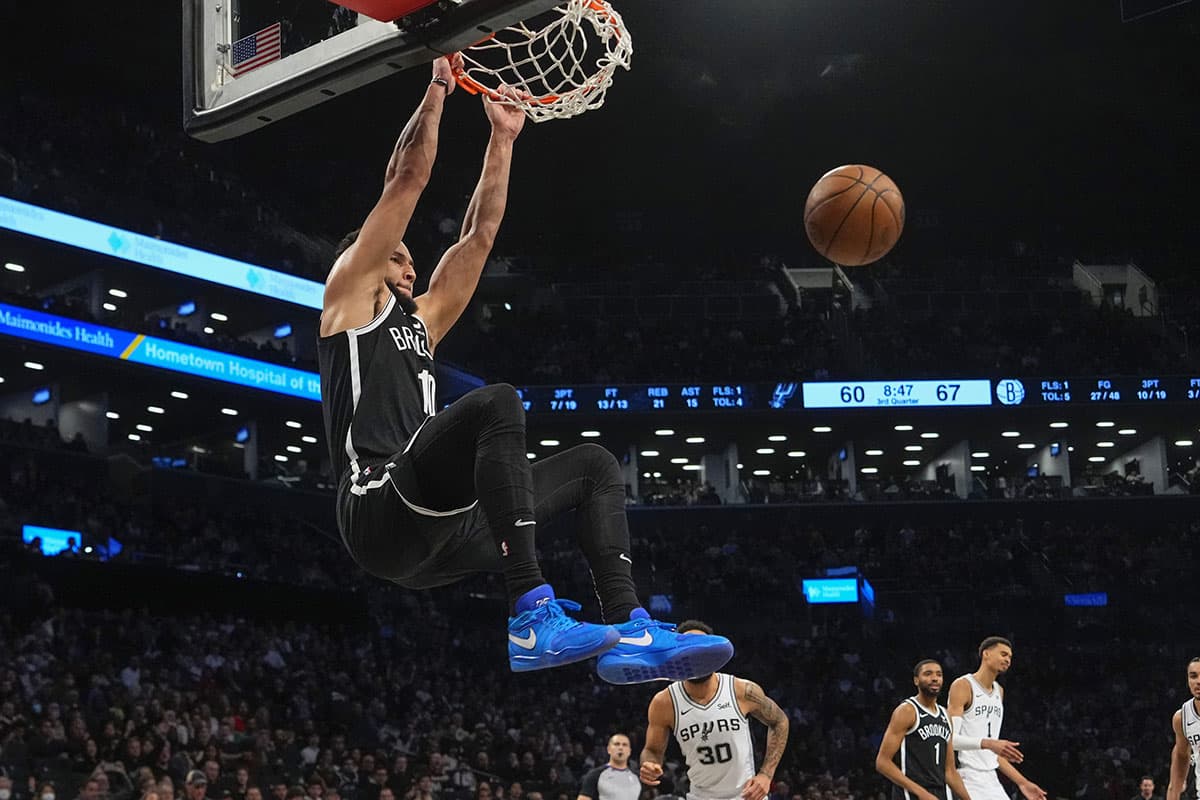 Brooklyn Nets point guard Ben Simmons (10) dunks the ball against the San Antonio Spurs during the second half at Barclays Center.