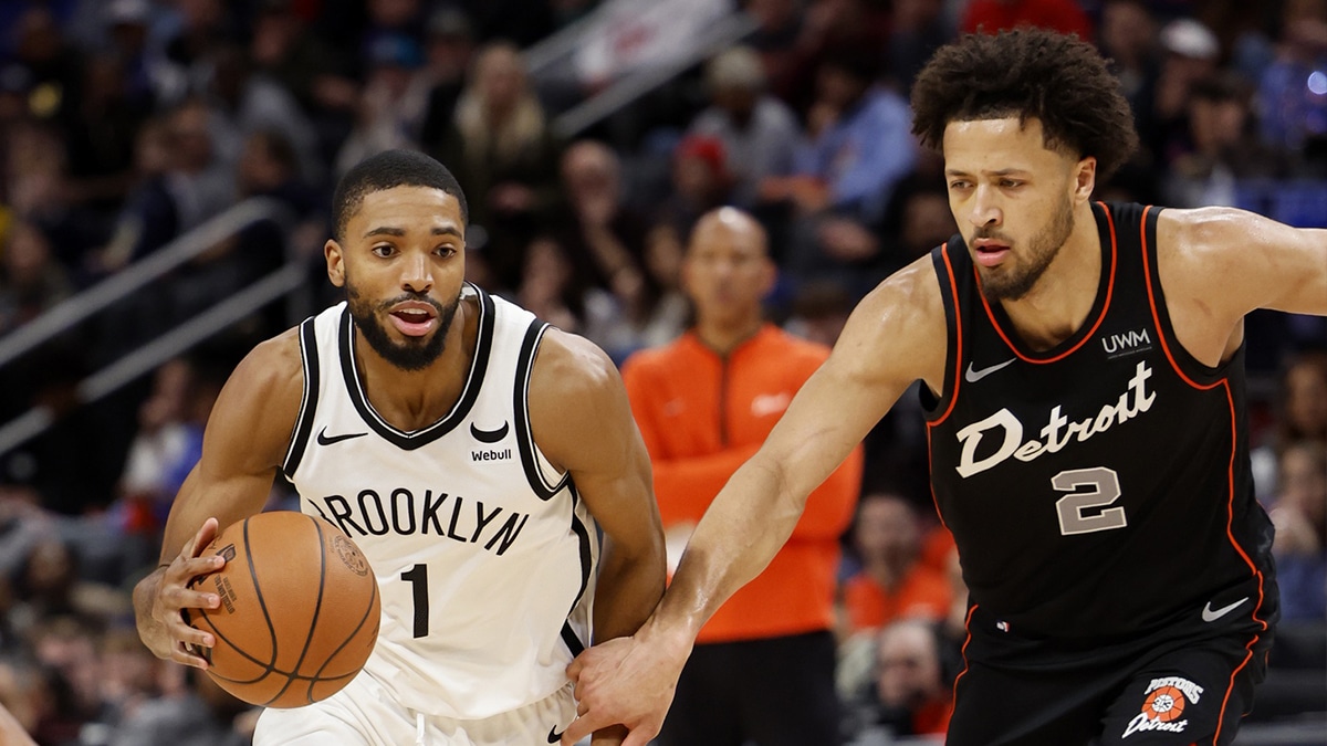 Brooklyn Nets forward Mikal Bridges (1) dribbles while defended by Detroit Pistons guard Cade Cunningham (2) in the second half at Little Caesars Arena