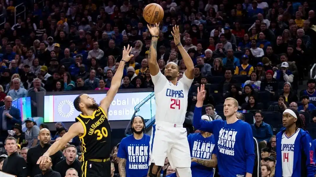 San Francisco, California, USA; LA Clippers guard Norman Powell (24) hits a three-point shot against the Golden State Warriors during the second half at Chase Center.