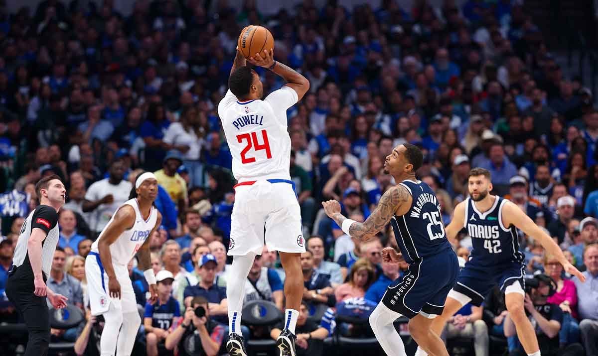 LA Clippers guard Norman Powell (24) shoots over Dallas Mavericks forward P.J. Washington (25) during the first quarter during game four of the first round for the 2024 NBA playoffs at American Airlines Center. 