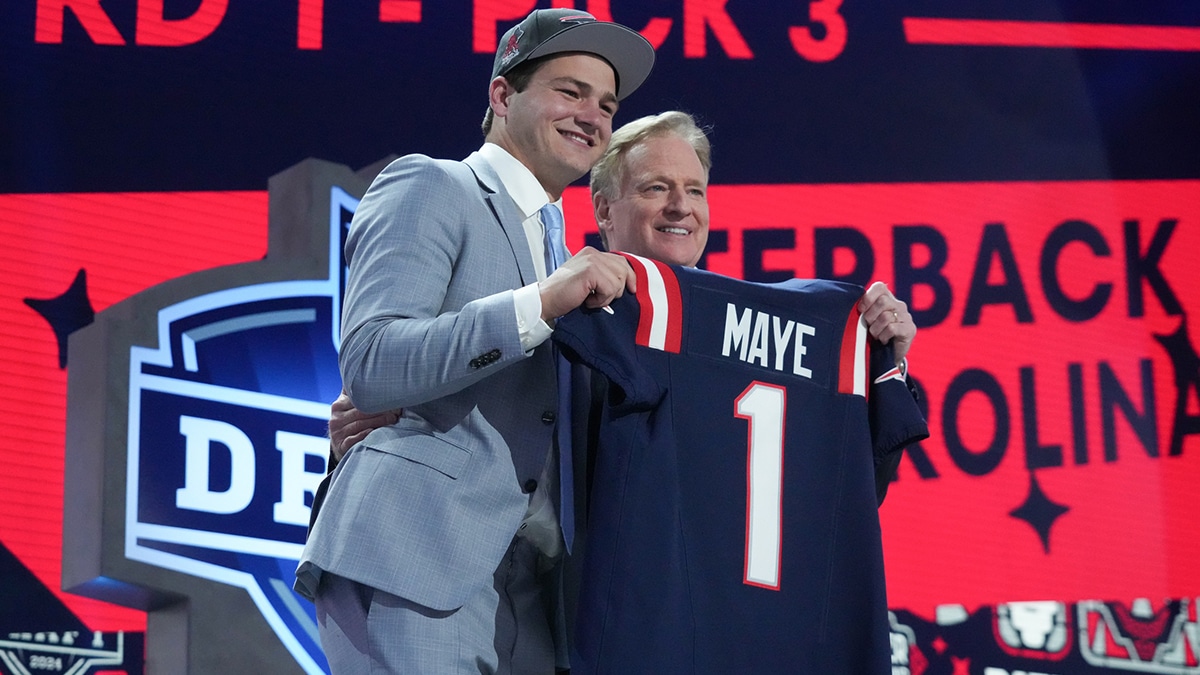 North Carolina Tar Heels quarterback Drake Maye poses with NFL commissioner Roger Goodell after being selected by the New England Patriots as the No. 3 pick in the first round of the 2024 NFL Draft at Campus Martius Park and Hart Plaza