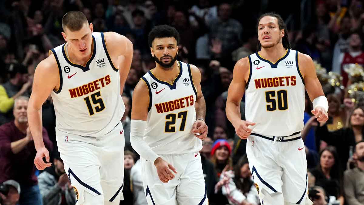 Denver Nuggets guard Jamal Murray (27) and center Nikola Jokic (15) and forward Aaron Gordon (50) following a score in the fourth quarter against the Miami Heat at Ball Arena