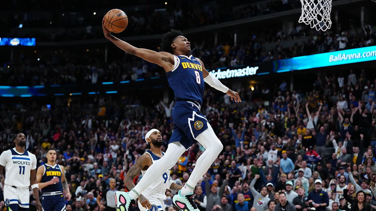 Denver Nuggets forward Peyton Watson (8) prepares to dunk ball in the fourth quarter against the Minnesota Timberwolves at Ball Arena.