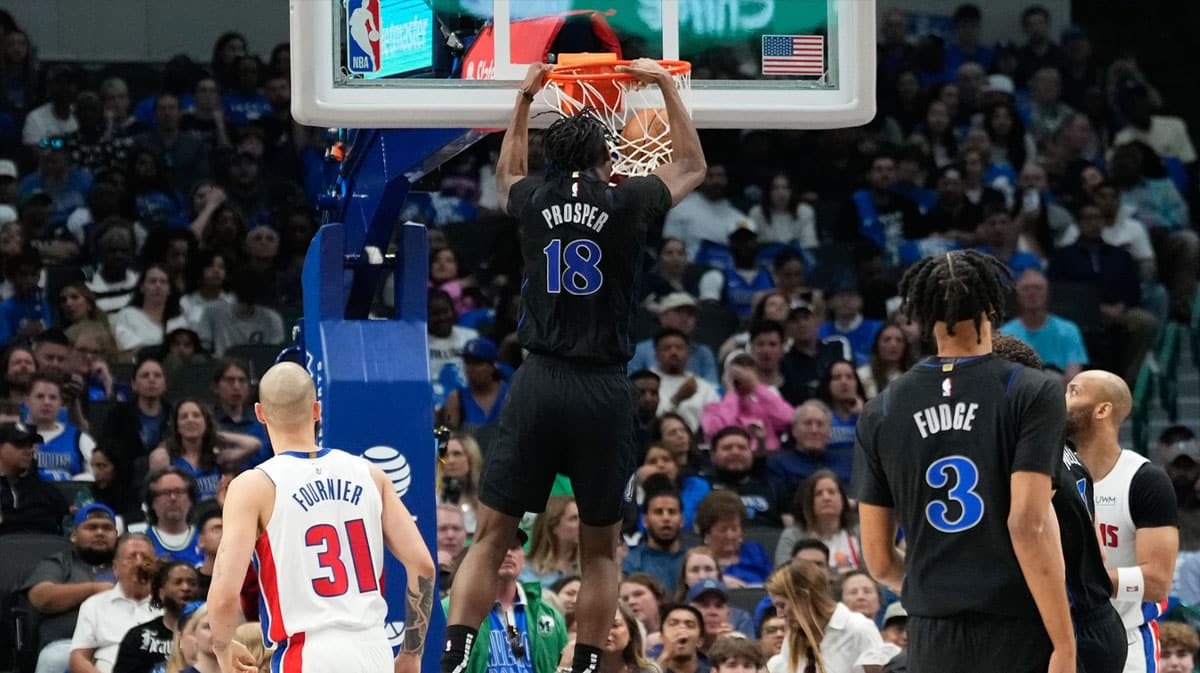 Dallas Mavericks forward Olivier-Maxence Prosper (18) dunks the ball past Detroit Pistons guard Evan Fournier (31) during the second half at American Airlines Center. 
