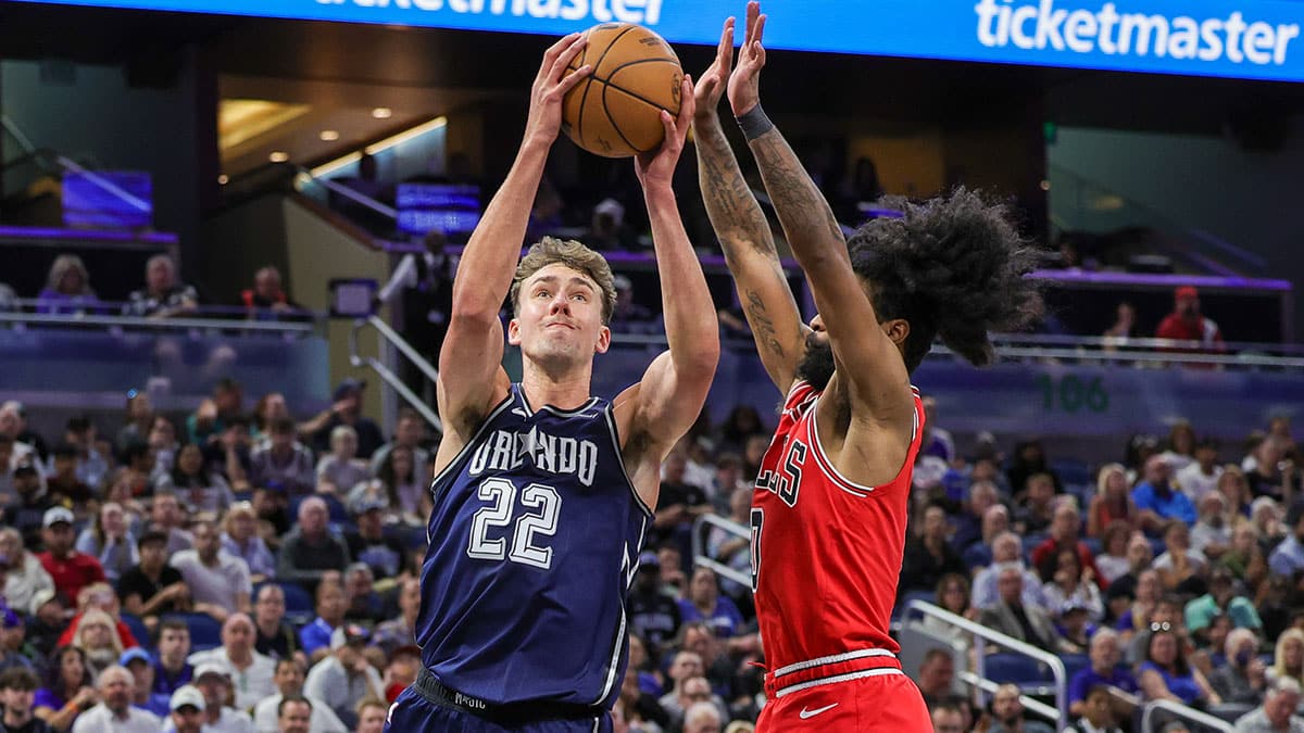 Apr 7, 2024; Orlando, Florida, USA; Orlando Magic forward Franz Wagner (22) goes to the basket in front of Chicago Bulls guard Coby White (0) during the second quarter at KIA Center. Mandatory Credit: Mike Watters-USA TODAY Sports