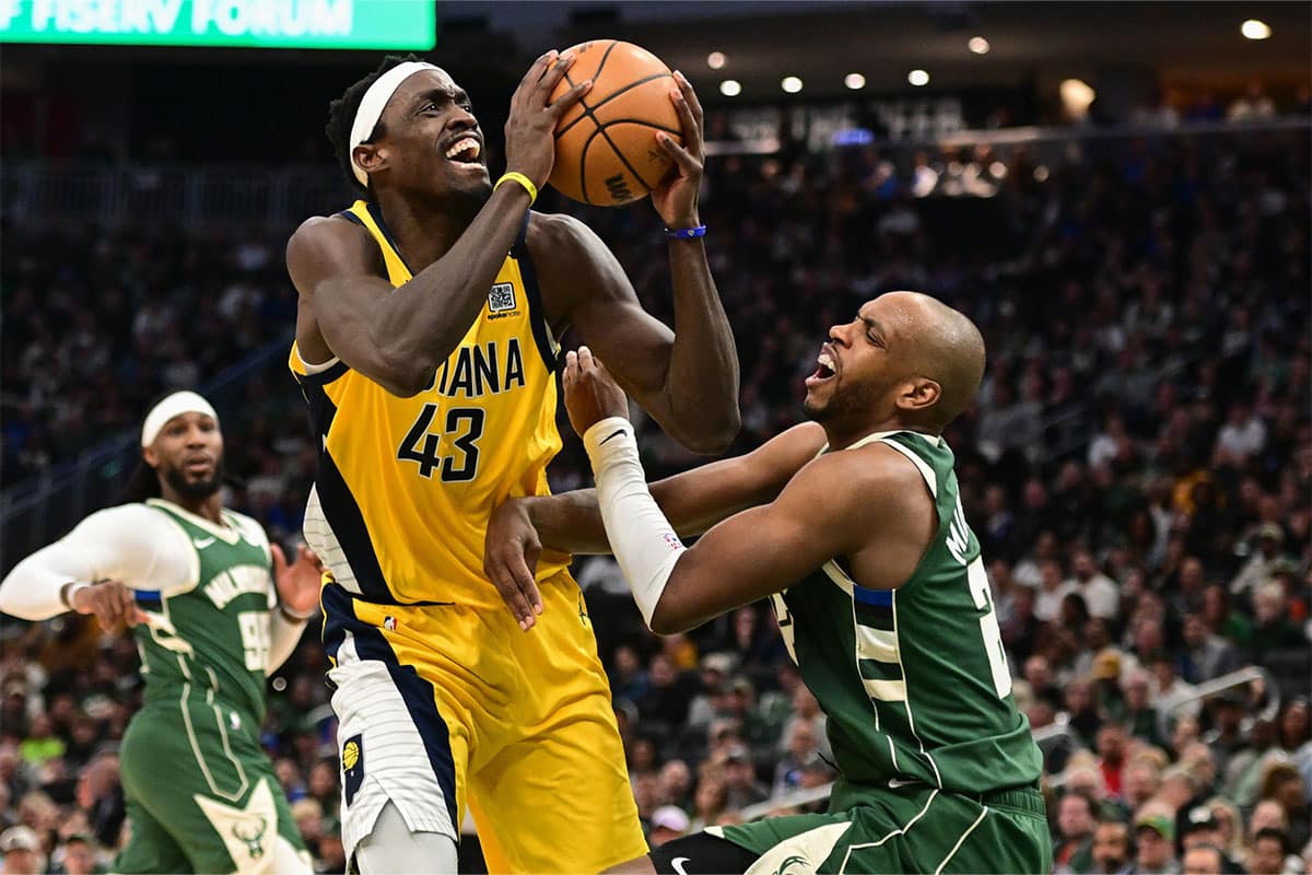 Indiana Pacers forward Pascal Siakam (43) takes a shot against Milwaukee Bucks forward Khris Middleton (22) in the fourth quarter during game one of the first round for the 2024 NBA playoffs at Fiserv Forum.