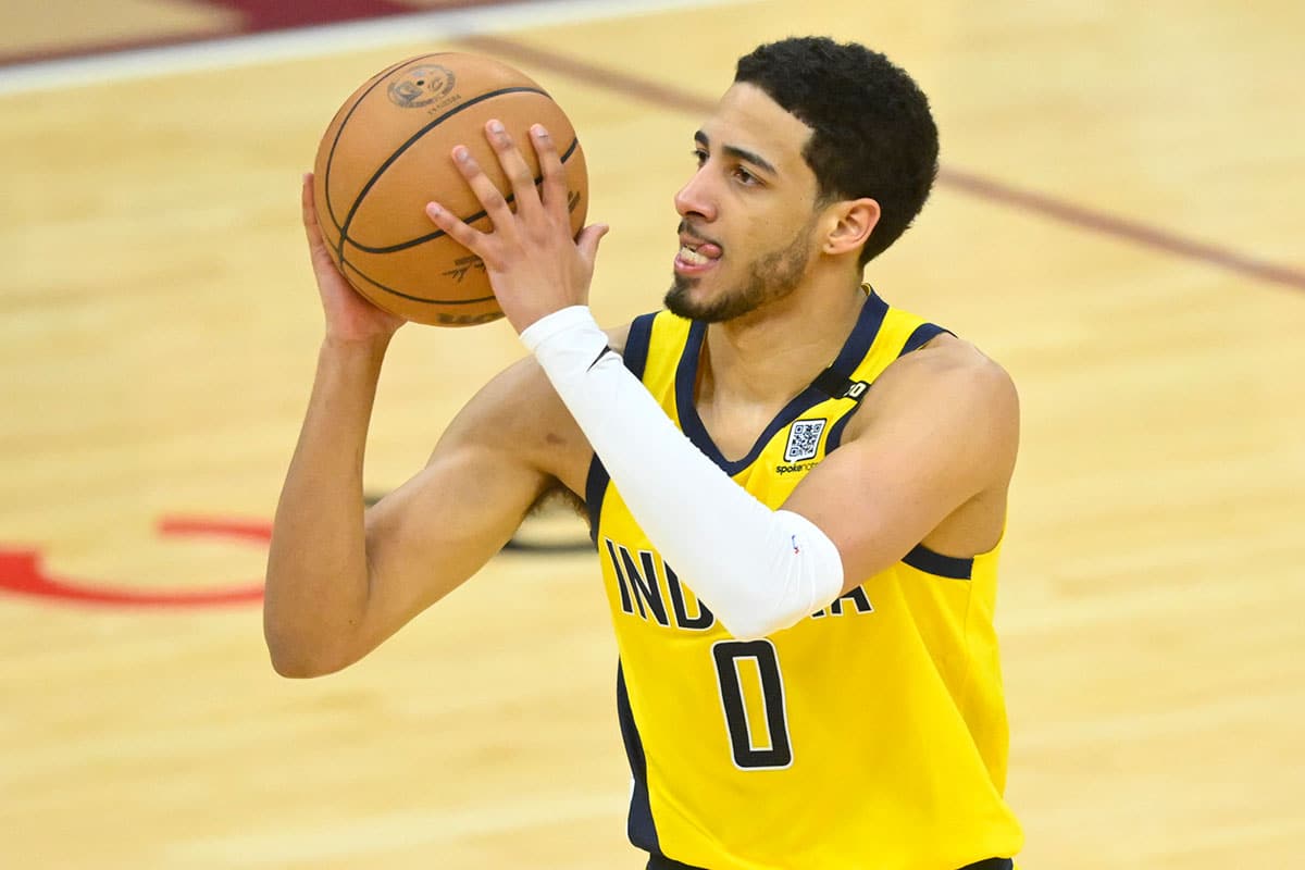 Indiana Pacers guard Tyrese Haliburton (0) shoots a three-point basket in the fourth quarter against the Cleveland Cavaliers at Rocket Mortgage FieldHouse.