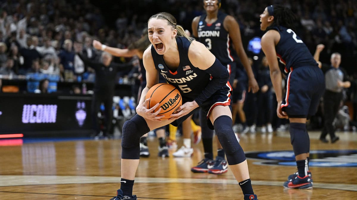 UConn Huskies guard Paige Bueckers (5) celebrates after beating the USC Trojans in the finals of the Portland Regional of the NCAA Tournament at the Moda Center